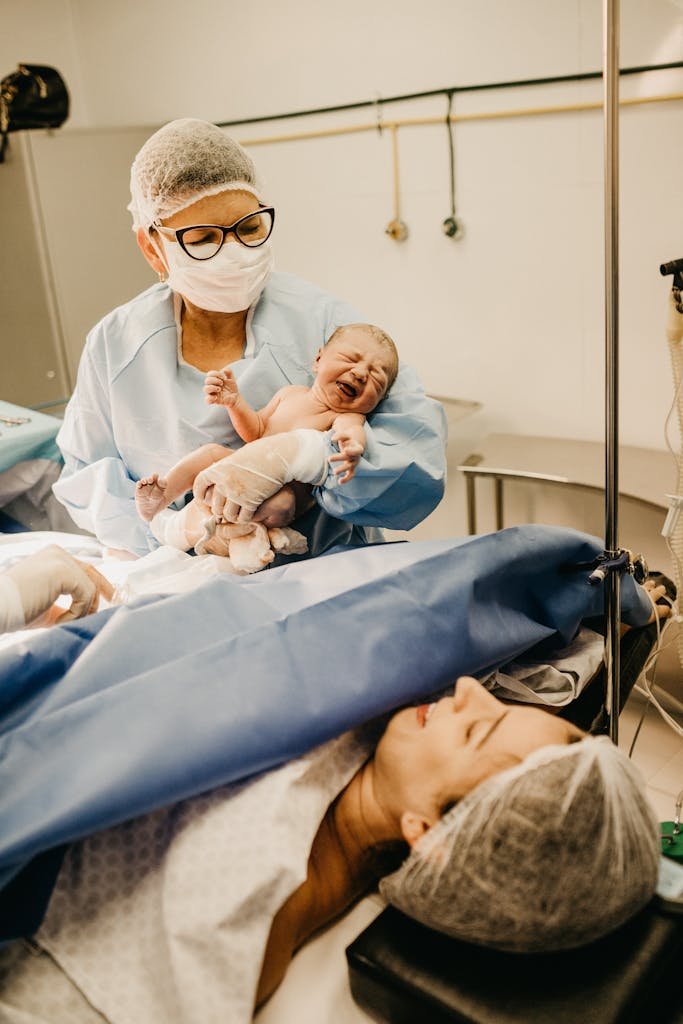 Mother seeing baby after caesarean birth